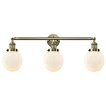 Beacon Bathroom Vanity Light - Antique Brass / Matte White