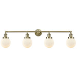 Beacon Bathroom Vanity Light - Antique Brass / Matte White