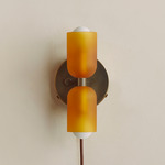 Chromatic Glass Up Down Plug-In Wall Sconce - Patina Brass Canopy / Sandblasted Amber