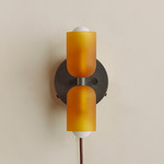 Chromatic Glass Up Down Plug-In Wall Sconce - Blackened Brass Canopy / Sandblasted Amber